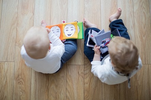 Two Children Engaged in Storytime